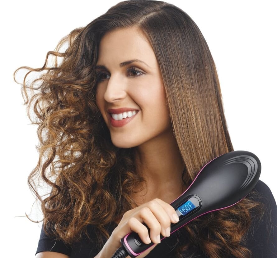 Girl straightens her hair with the brush