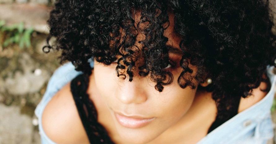 Curly girl looking up