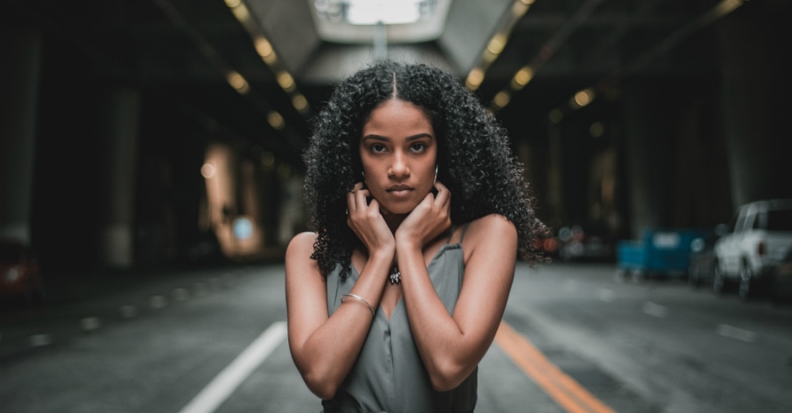 woman doing pose on asphalt road