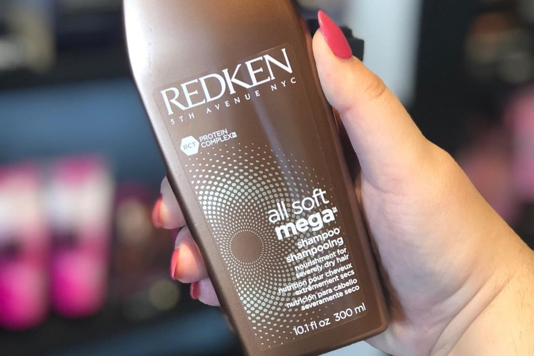 Redken shampoo at hand