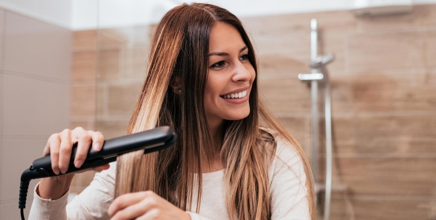 smiling-woman-with-flat-iron