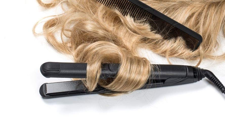 blond hair and curling iron