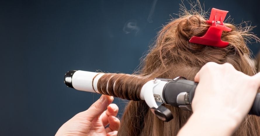 curling wand in use