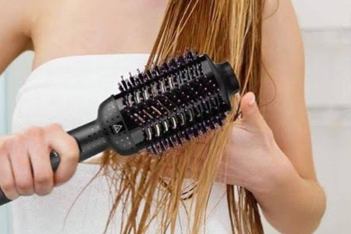 blow dryer brush sectioning the hair