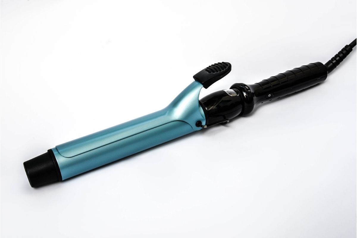 curling iron on white background