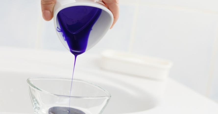pouring purple hair shampoo